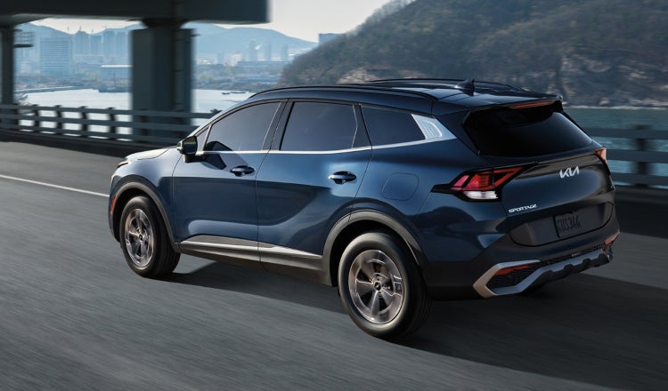 Blue Kia SUV on the Highway
