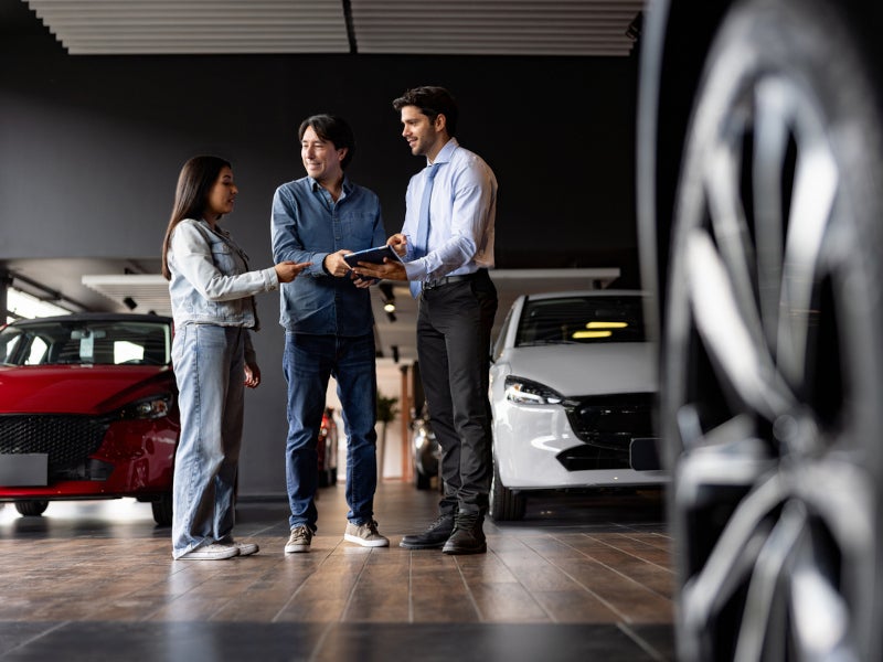 Savage Kia Salesperson helping their customers